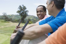Multi-ethnic men on golf course